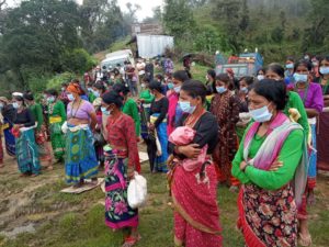 Women in Achham in the distribution of basic food