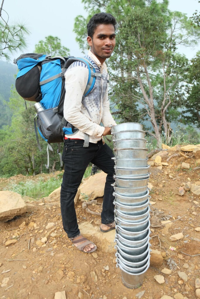 Transporting materials along a mountain path in Nepal