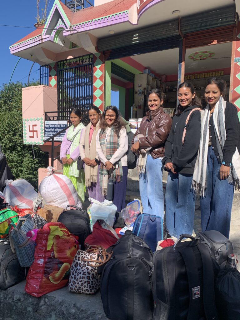 Local team with bags and project materials for travel